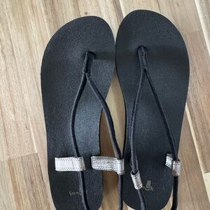 Black Sanuk Flip Flops with Silver Accents size 8